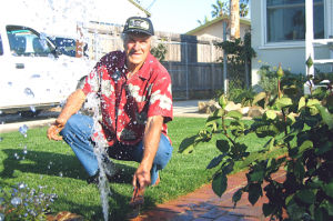 Arlington TX sprinkler repair tech observes faulty head