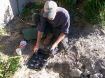 a valve control box being installed in a TX backyard
